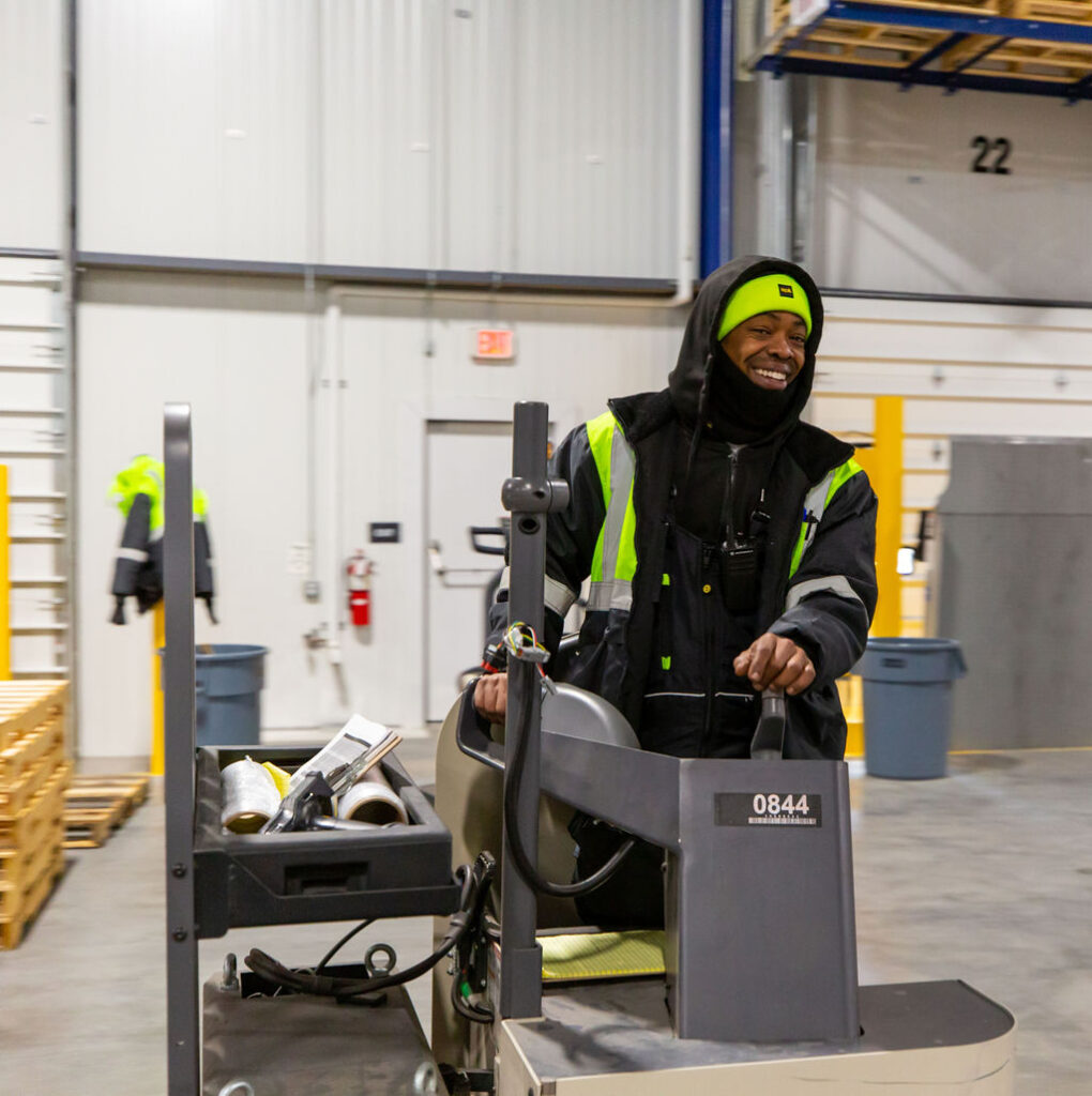 All smiles in this cold storage warehouse.