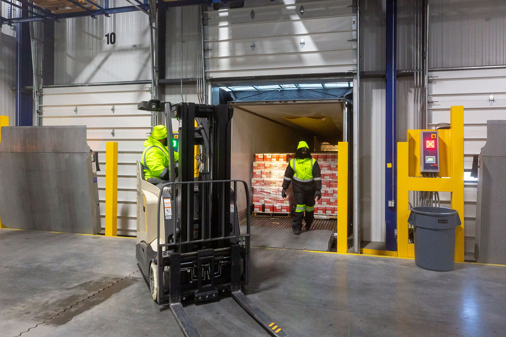 FlexCold Teammates unloading product from a customer's truck.